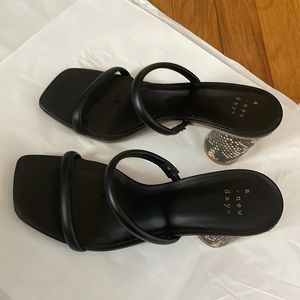 Black strap snakeskin block heels